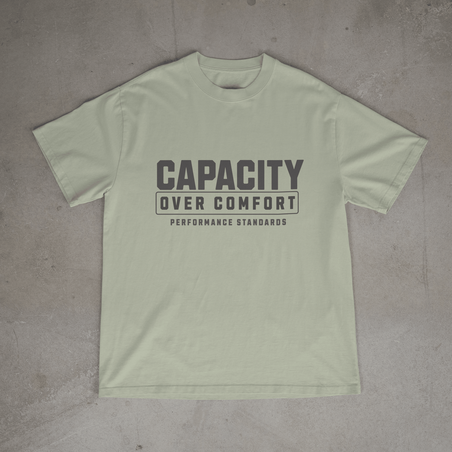 Light green mens  gym t shirt with 'Capacity Over Comfort' text on chest