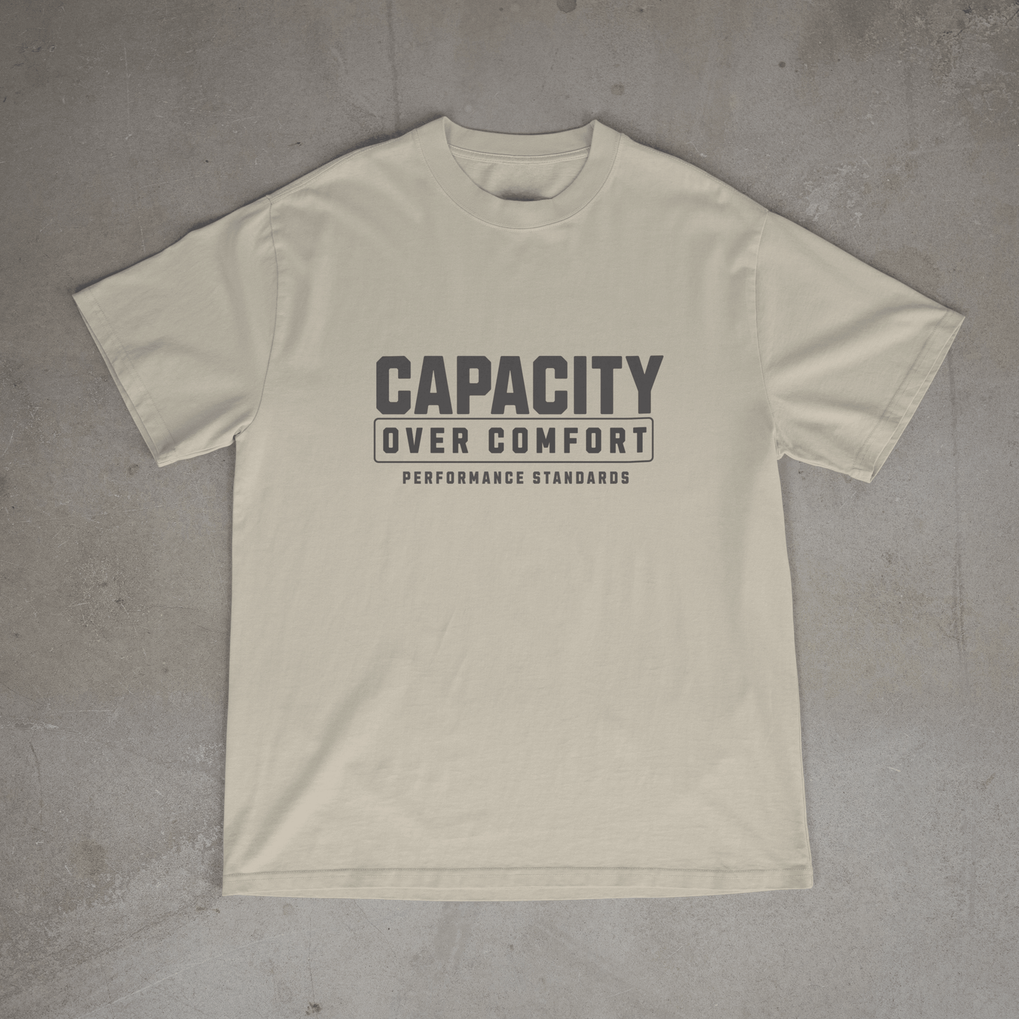 Sand colour mens  gym t shirt with 'Capacity Over Comfort' text on chest