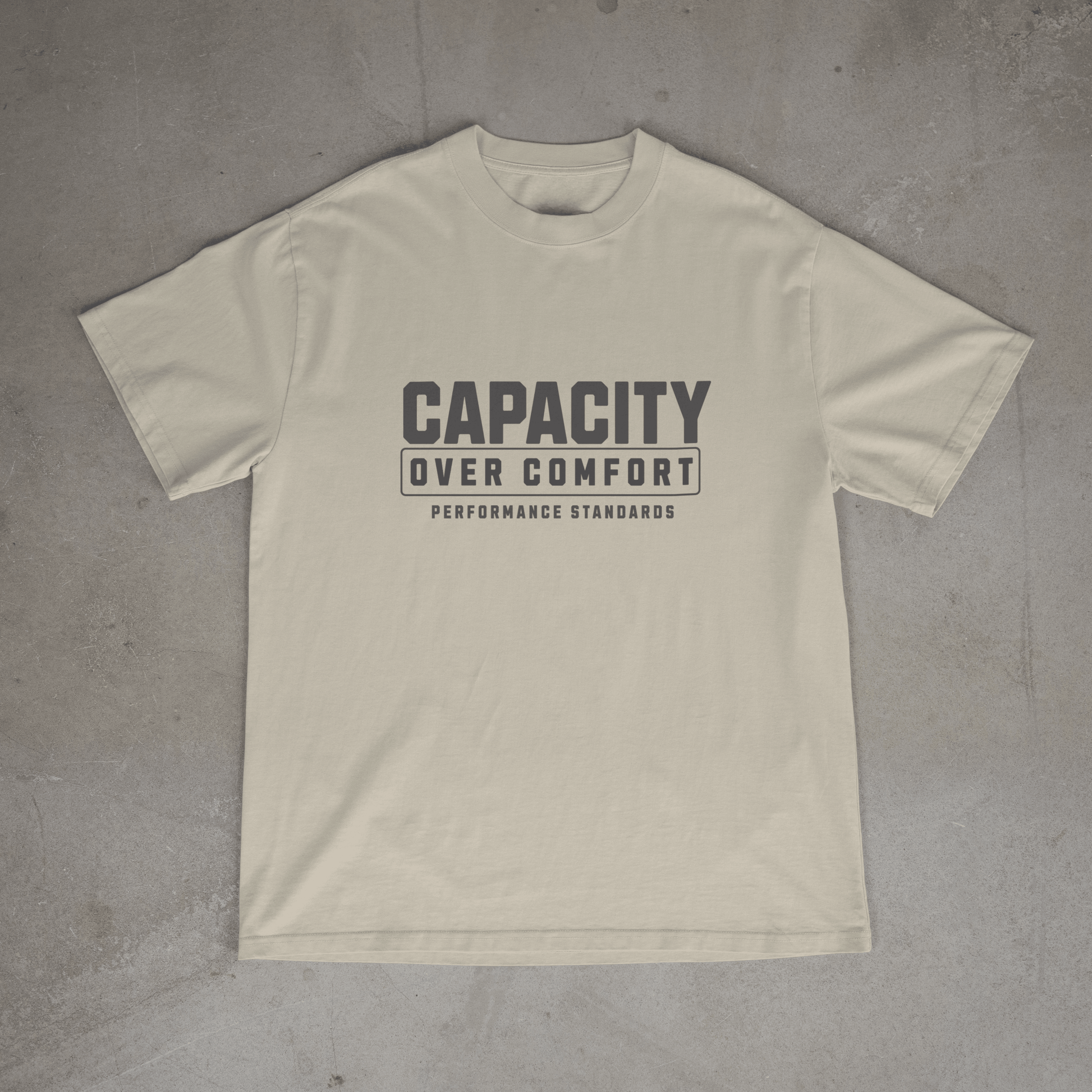 Sand colour mens  gym t shirt with 'Capacity Over Comfort' text on chest